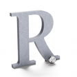 Flat cut aluminum letter R with a radial brushed finish.
