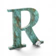 Weathered turquoise patina bronze or brass sign letter R.