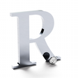 Polished aluminum sign letter R.