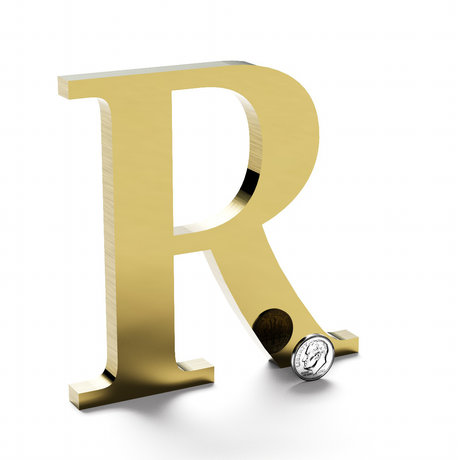Polished brass sign letter R.
