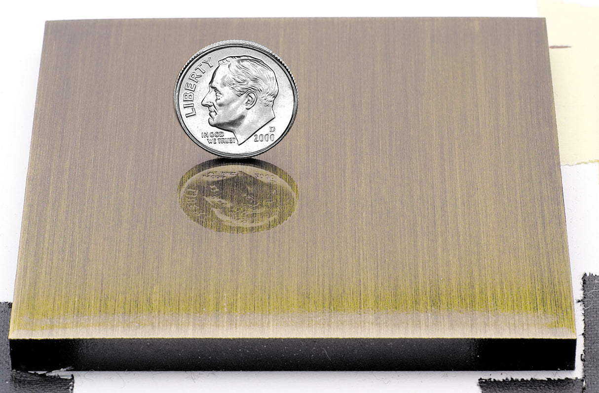 Sample of an lightly aged brass finish for sign letters.