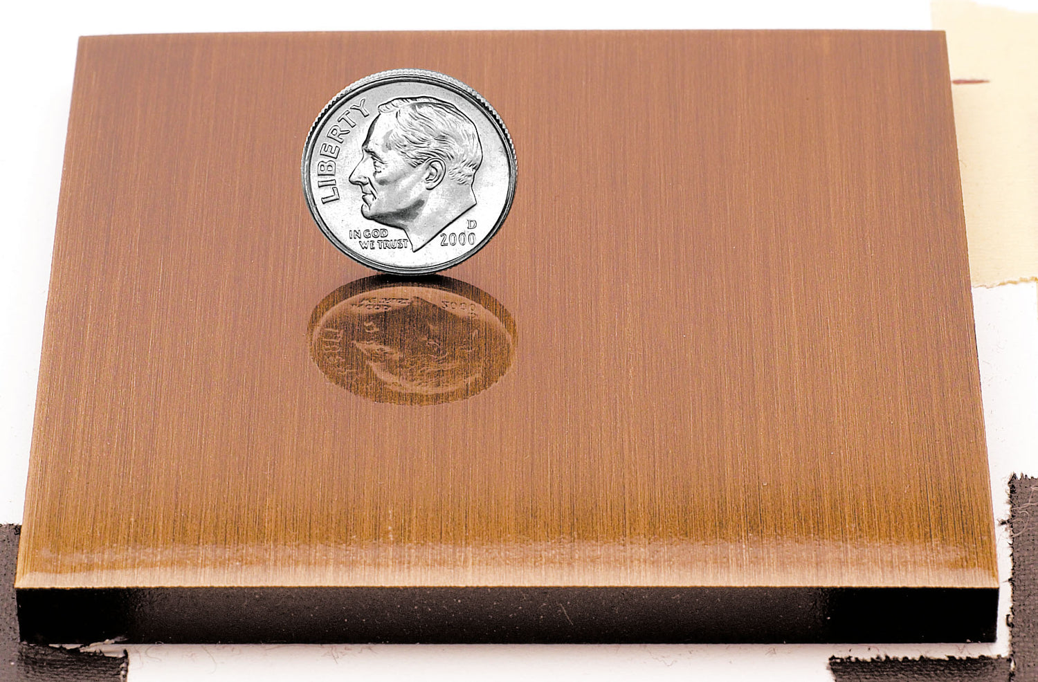 Sample of a light aged copper finish for sign letters.