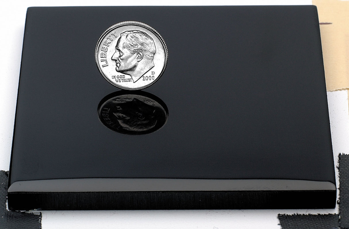 Sample of polished black anodized aluminum finish for sign letters.