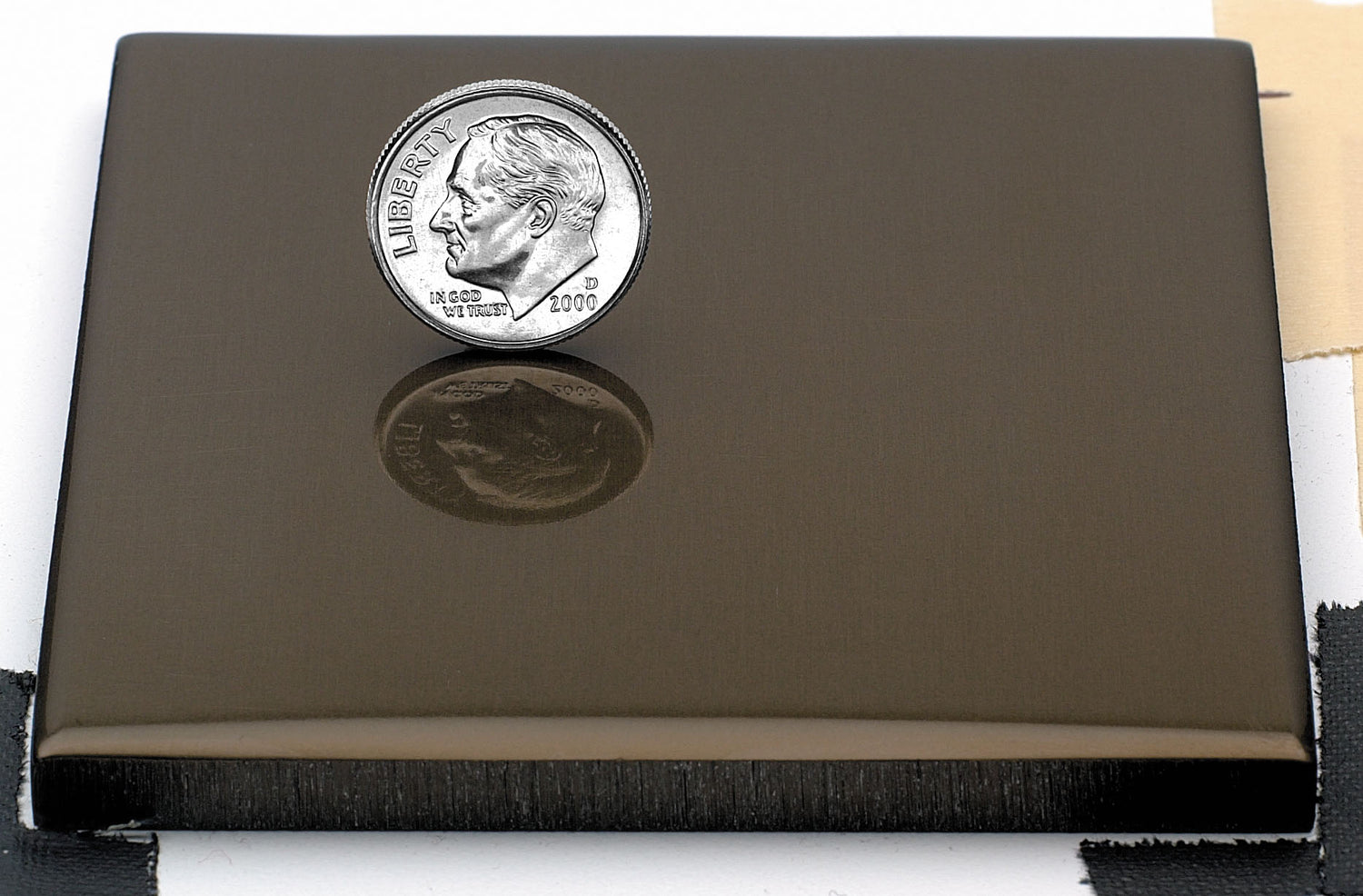 Sample of polished bronze anodized aluminum finish for sign letters.