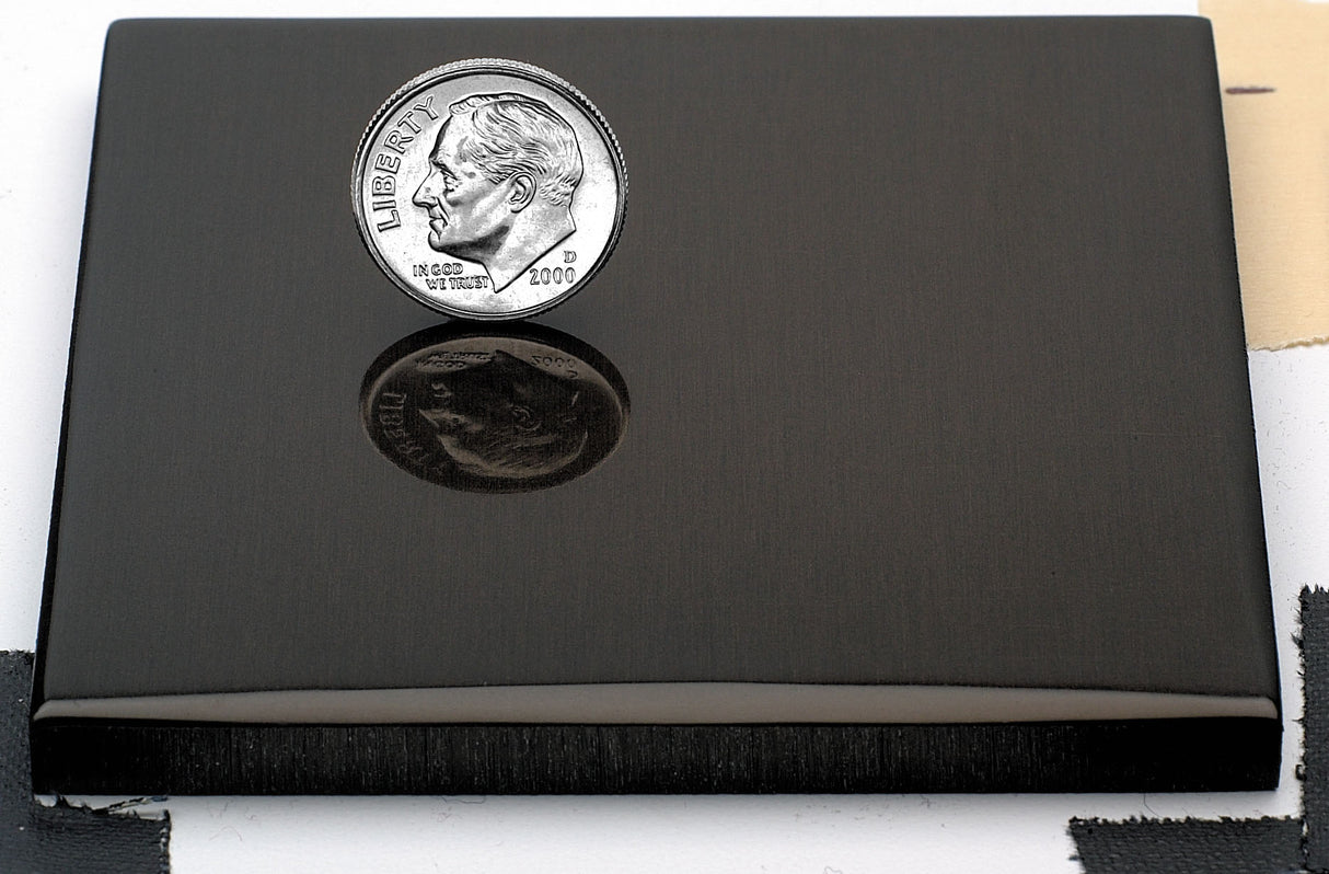 Sample of polished black anodized aluminum finish for sign letters.