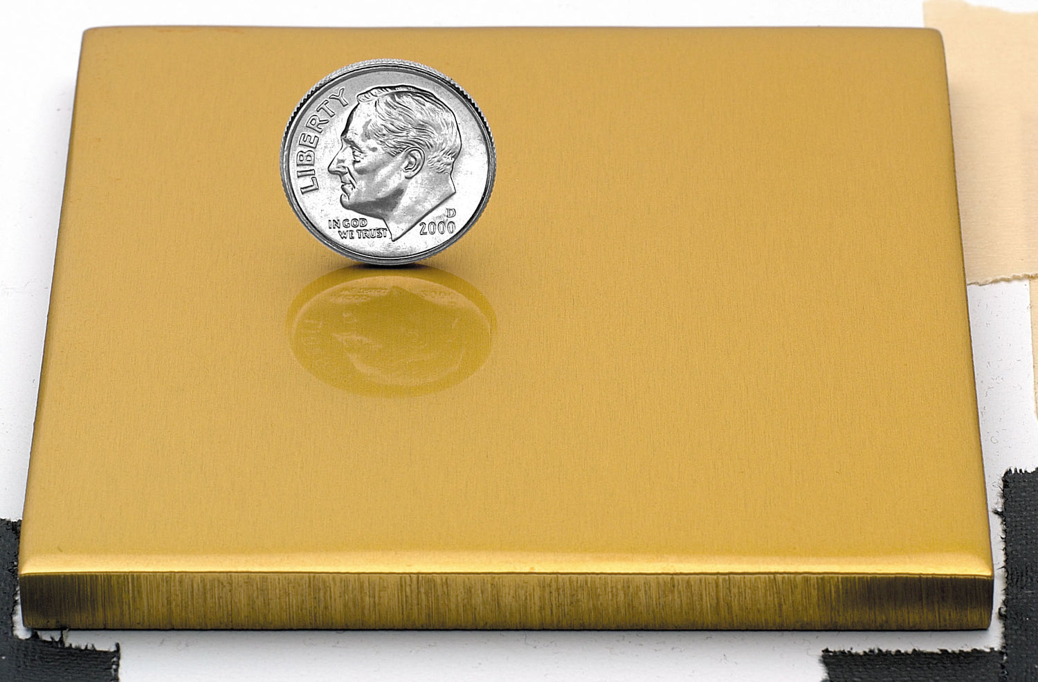 Sample of polished gold anodized aluminum finish for sign letters.