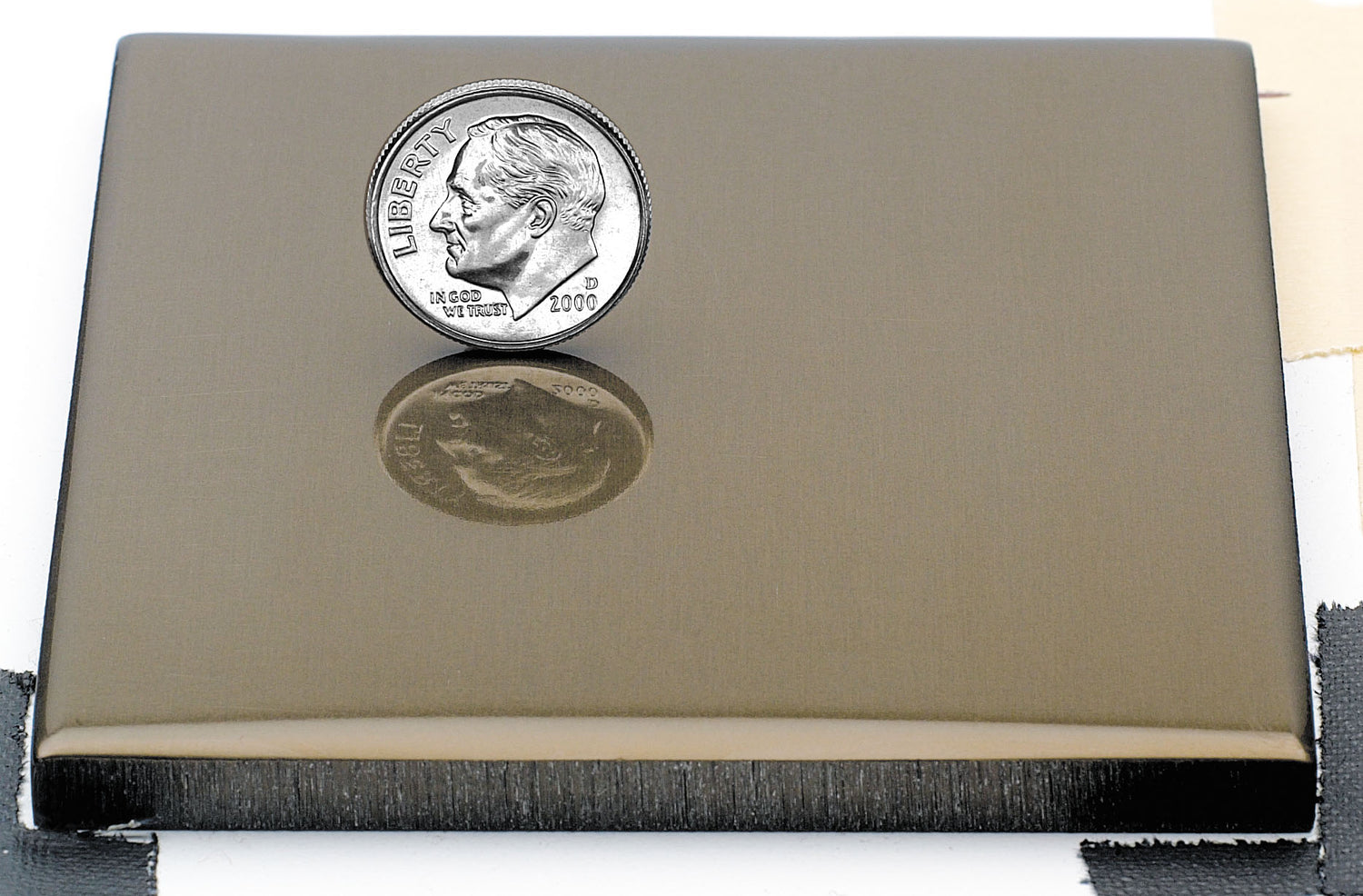 Sample of polished light bronze anodized aluminum finish for sign letters.