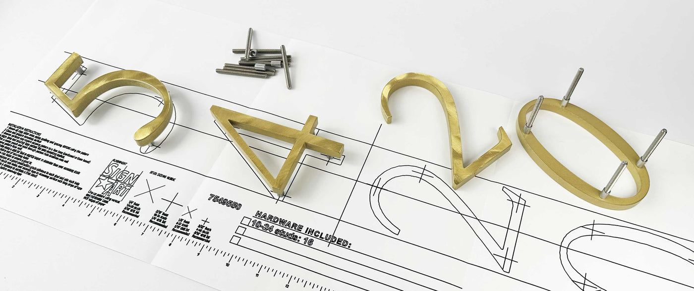 Random arc brushed brass division 10 architectural sign letters with stud mounts on mounting template