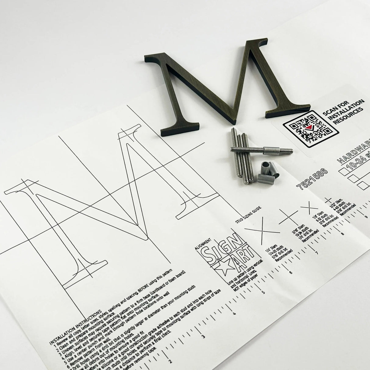 Aged solid brass division 10 architectural sign letter on mounting template with hardware