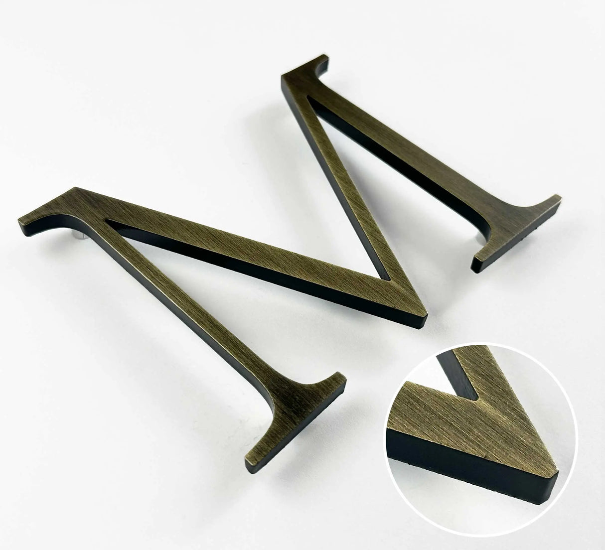 Heavily aged solid BAA & BABA certified brass division 10 architectural sign letter with finish closeup