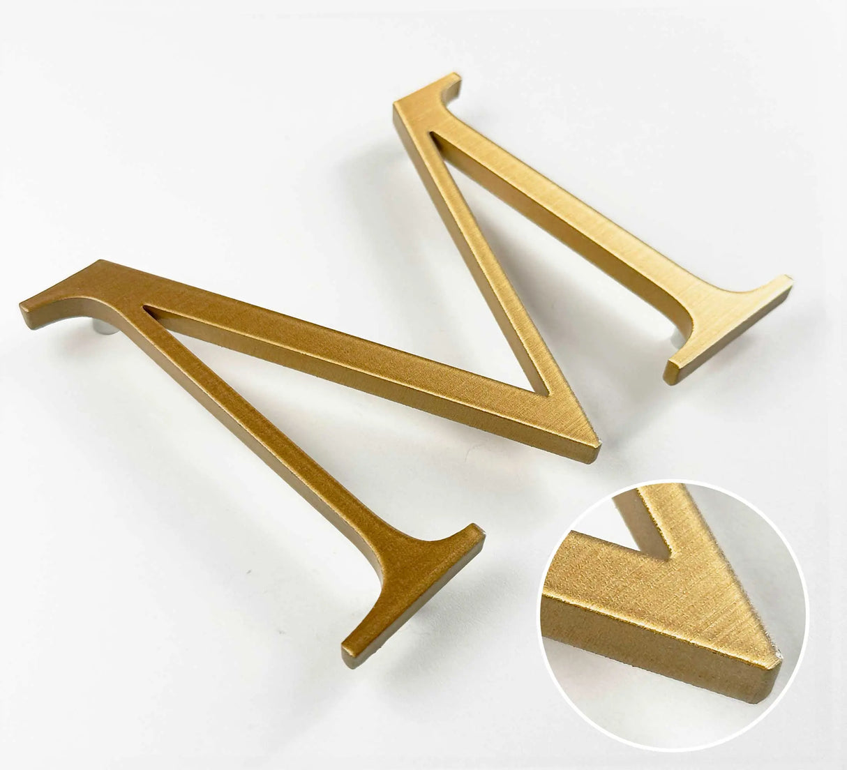 Horizontally brushed solid bronze division 10 architectural sign letter with finish closeup