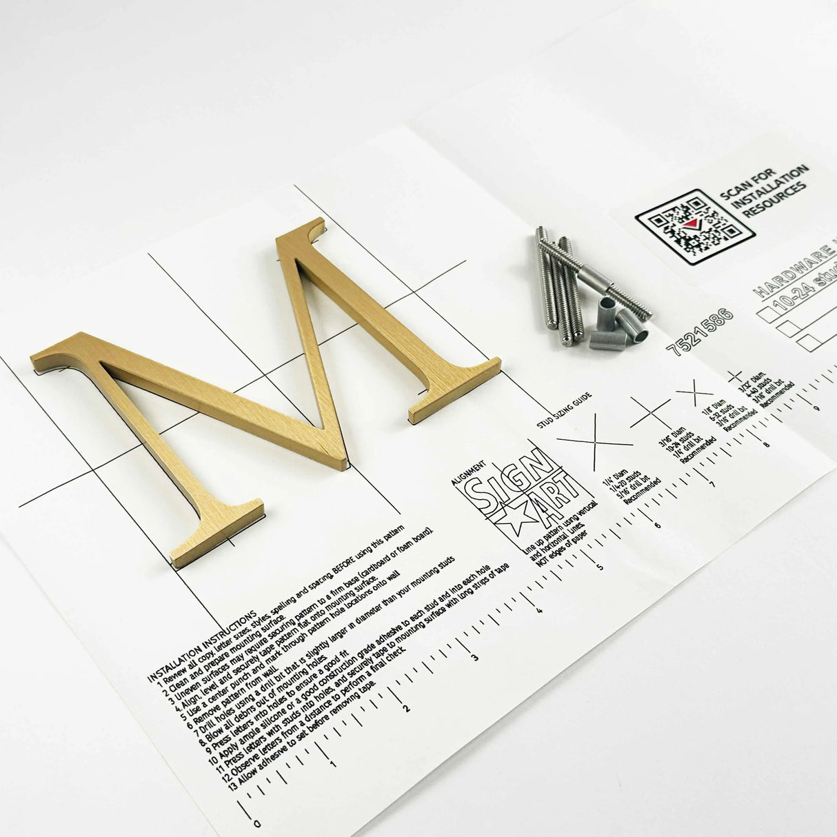 Vertically brushed solid bronze division 10 architectural sign letter on mounting template with hardware