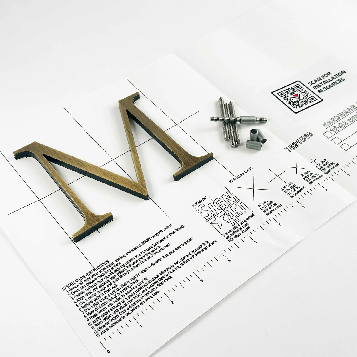 Lightly aged solid bronze division 10 architectural sign letter on mounting template with hardware