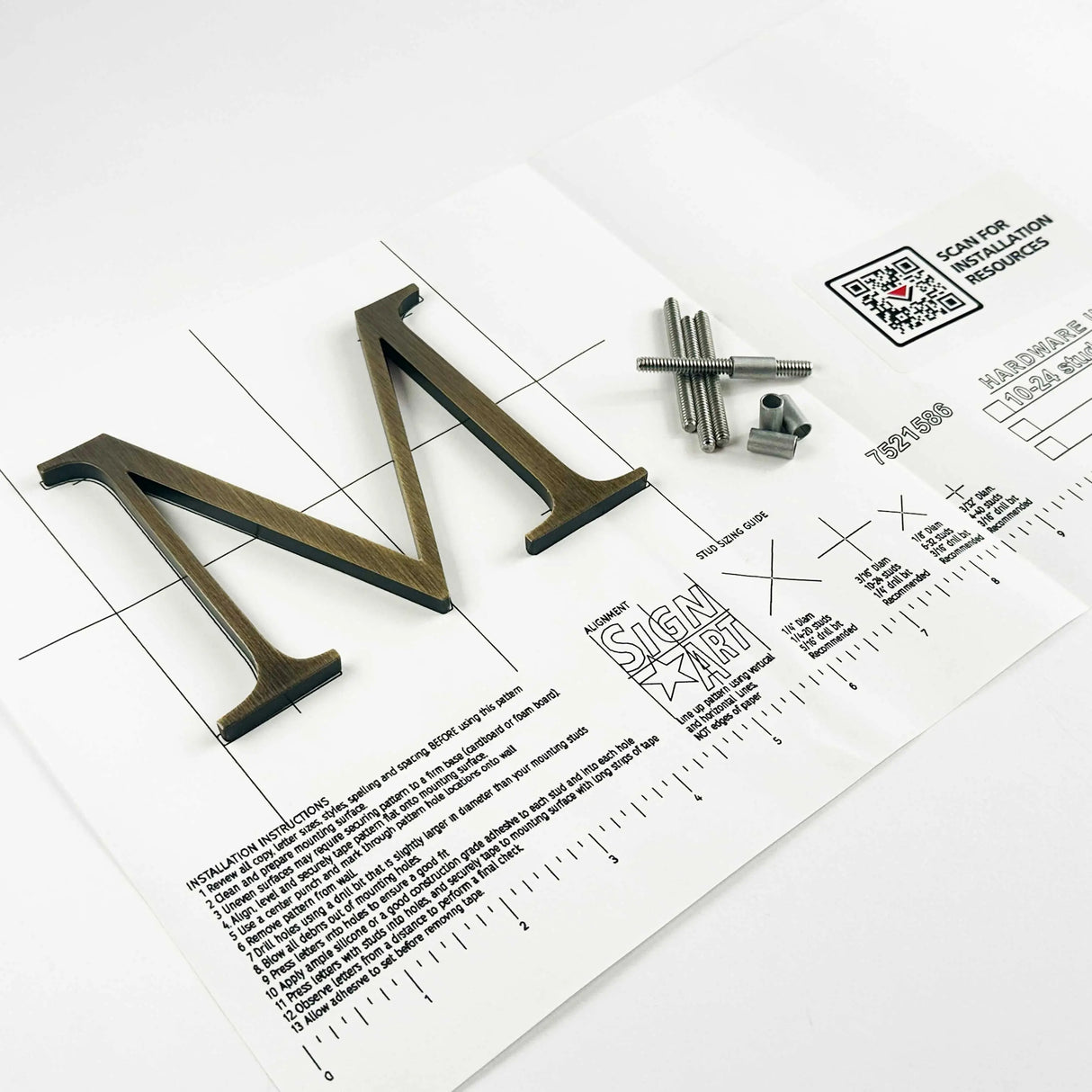 Aged solid bronze division 10 architectural sign letter on mounting template with hardware
