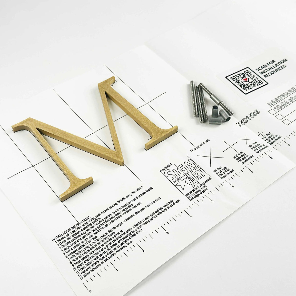 Orbitally brushed solid bronze division 10 architectural sign letter on mounting template with hardware