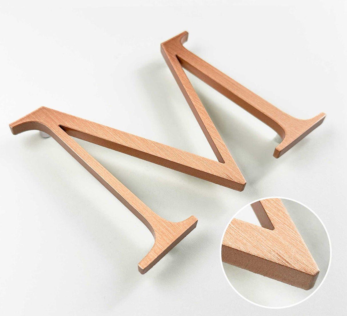 Vertically brushed solid copper division 10 architectural sign letter with finish closeup