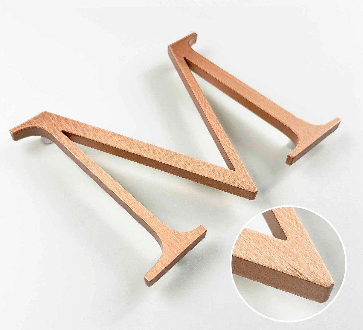 Vertically brushed solid copper division 10 architectural sign letter with finish closeup