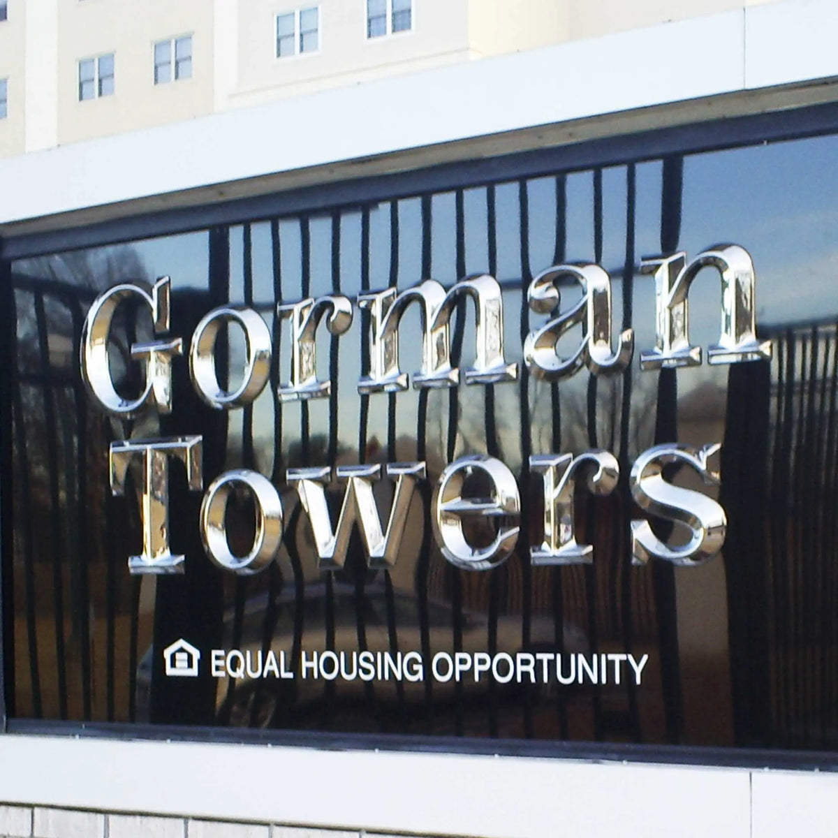 Chrome formed plastic letters with a prismatic face installed on a monument