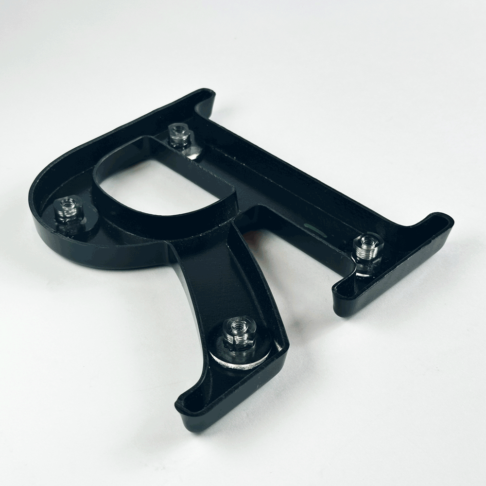 Formed plastic sign letter animating installation of back studs
