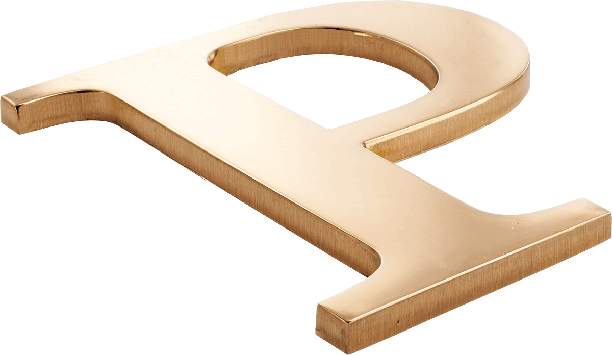 A bronze letter P with a polished face and brushed sides.