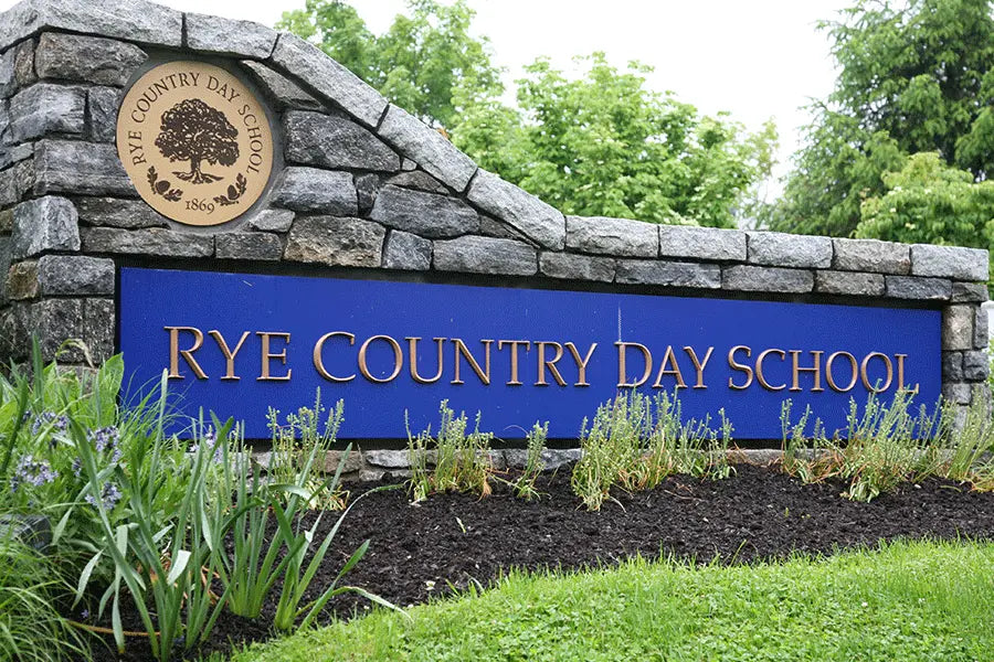 Monument sign with cast bronze sign letters with prismatic face in Architectural font