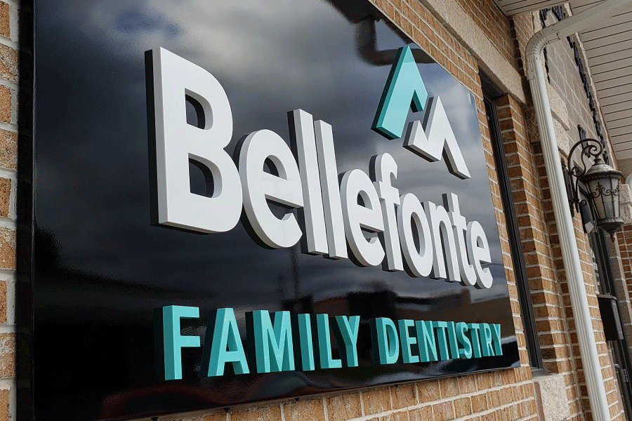 Dental office sign with painted acrylic sign letters and shapes.