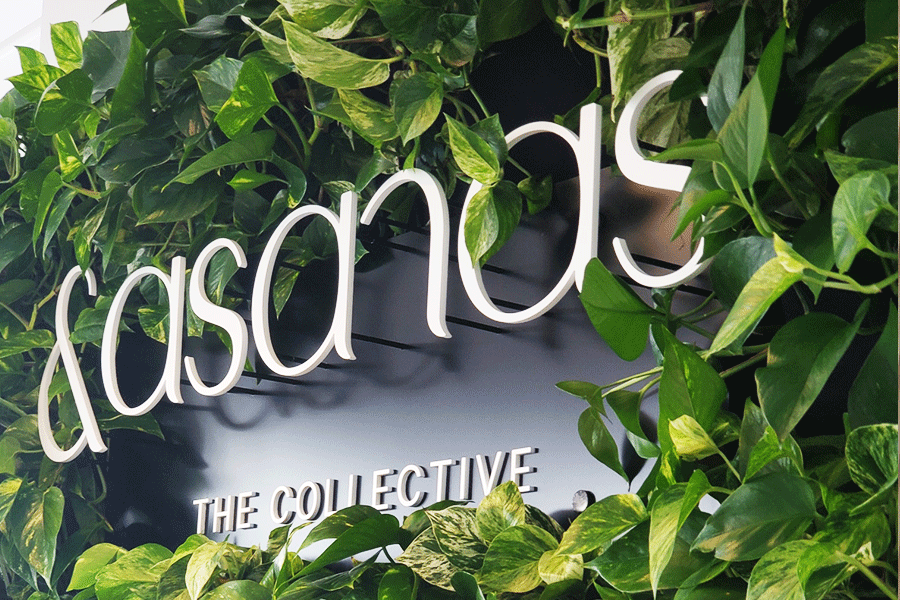 Store sign with white acrylic sign letters.