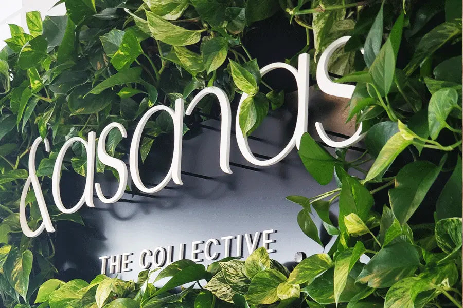 Store sign with white acrylic sign letters.