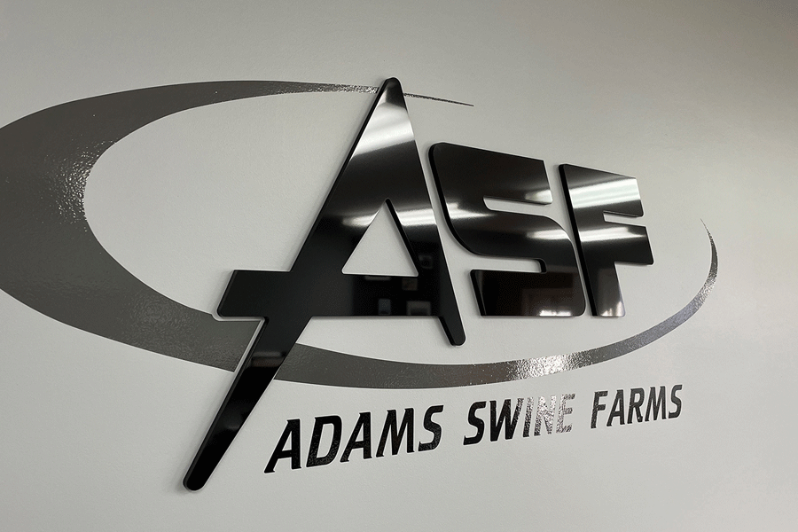 Farm sign with unpainted black acrylic sign letters.