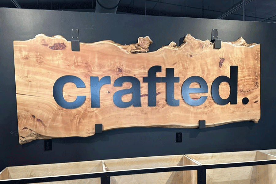 Interior business sign with unpainted black acrylic sign letters.