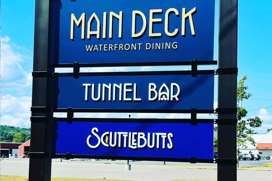 Restaurant sign with unpainted white acrylic sign letters.