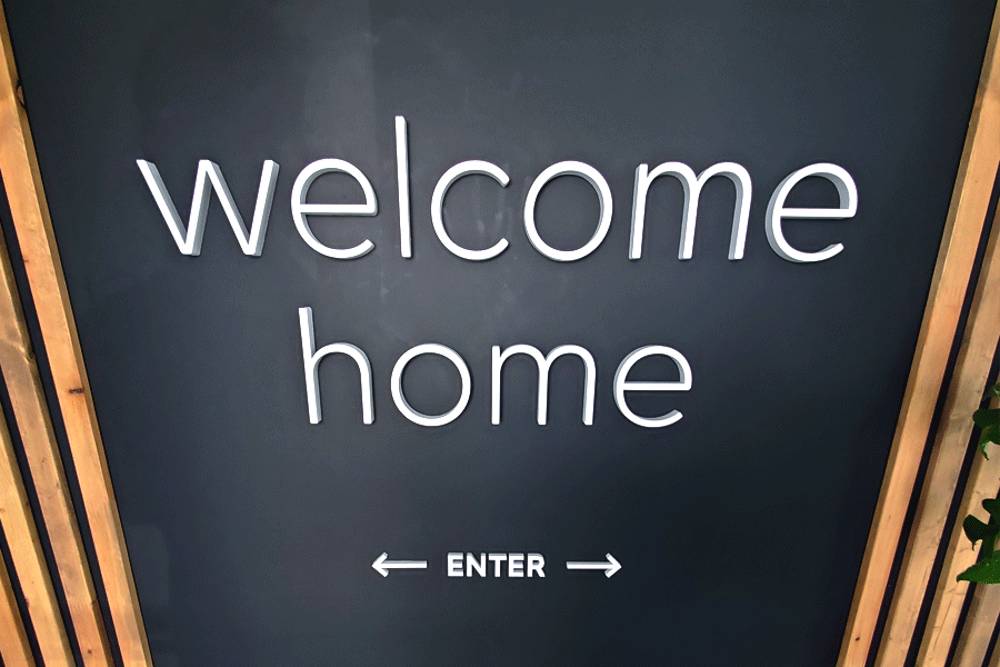 Welcome home sign with unpainted white acrylic sign letters.