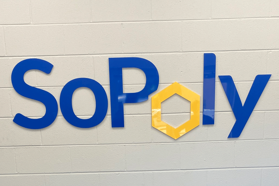 A business lobby sign for Sopoly with polished and painted acrylic sign letters.