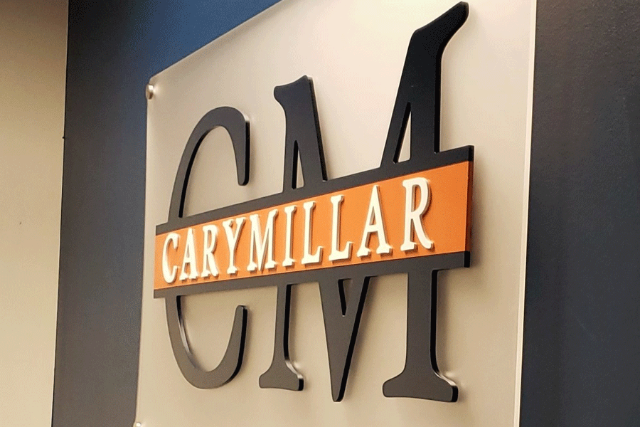 A law office's lobby sign with black and white acrylic sign letters.