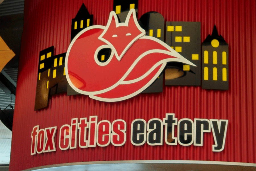 Flat cut acrylic restaurant sign for Fox Cities Eatery with sign letters and a fox layered over the top of a city skyline.