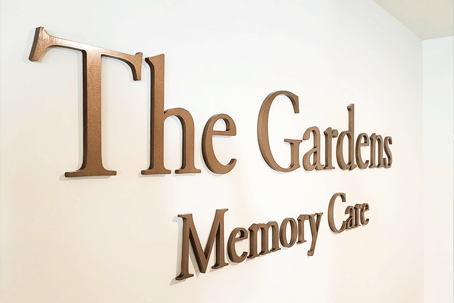 Lobby sign with bronze sign letters.