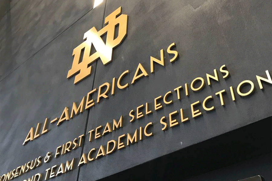 Commemorative wall with brass sign letters.