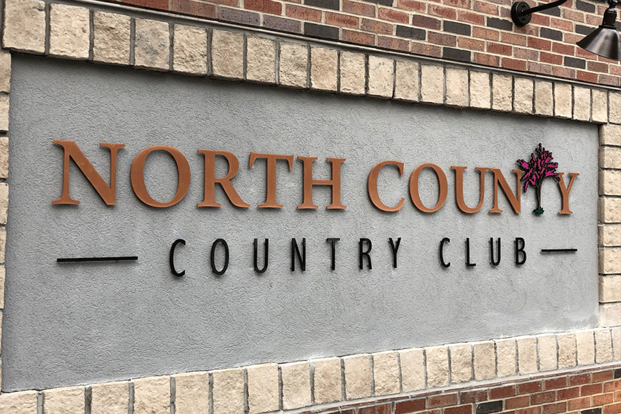 Country club with brushed copper sign letters