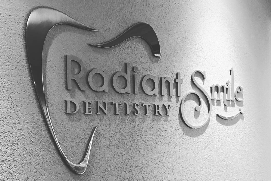 A dental office sign with polished aluminum sign letters and shapes.