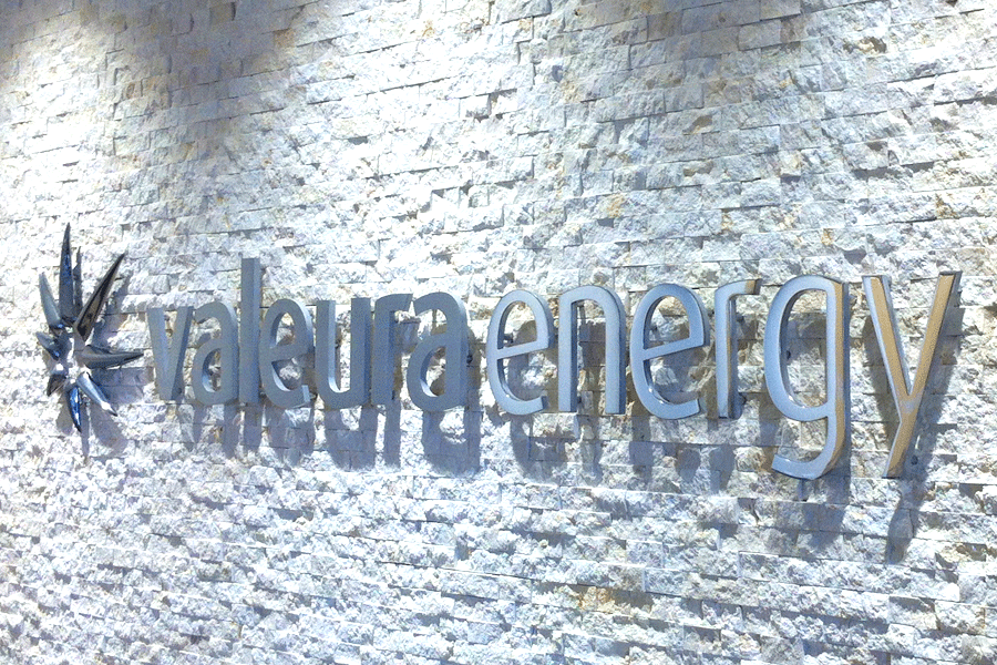 An interior wall sign with brushed and polished aluminum sign letters.
