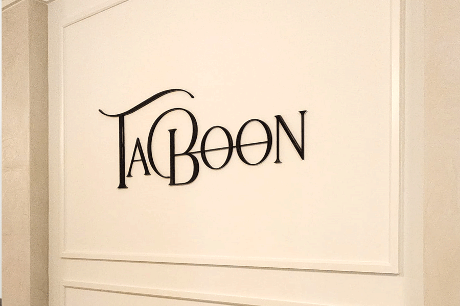 An interior store sign with black anodized aluminum sign letters.
