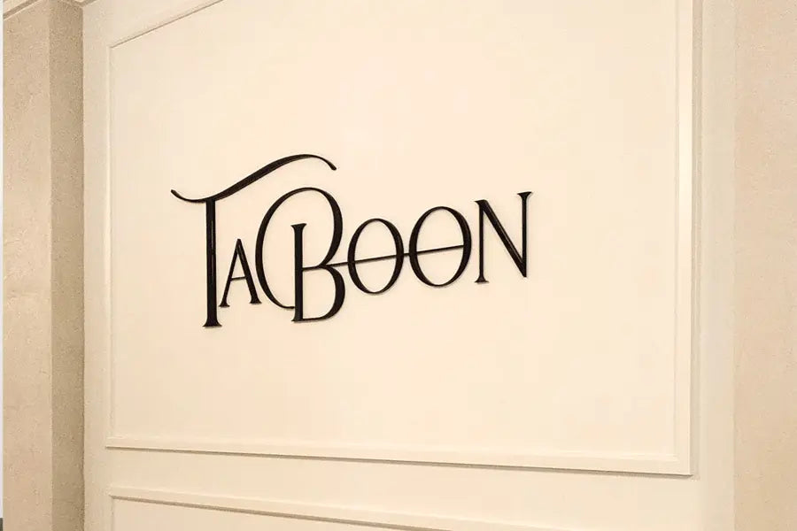 An interior store sign with black anodized aluminum sign letters.