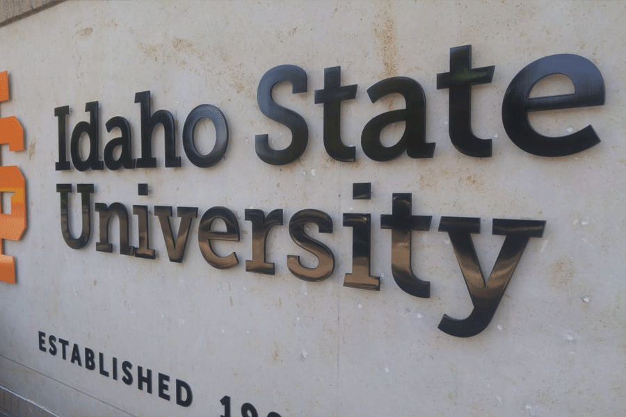 An exterior building sign with black anodized aluminum letters for Idaho State University.