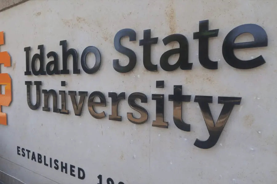 An exterior building sign with black anodized aluminum letters for Idaho State University.