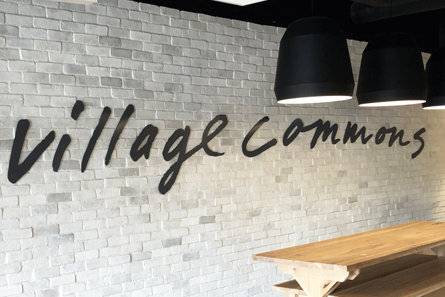 An interior wall sign with black anodized aluminum sign letters.