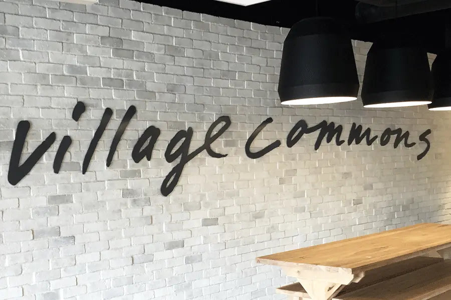 An interior wall sign with black anodized aluminum sign letters.