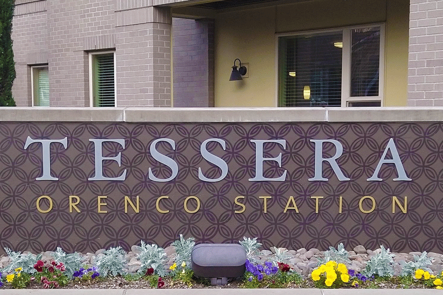 Exterior monument sign with brushed aluminum and gold anodized sign letters.