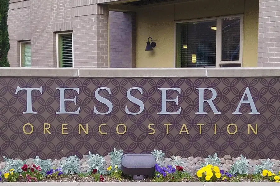 Exterior monument sign with brushed aluminum and gold anodized sign letters.