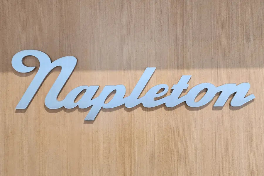 A flat cut aluminum lobby sign with a brushed finish.