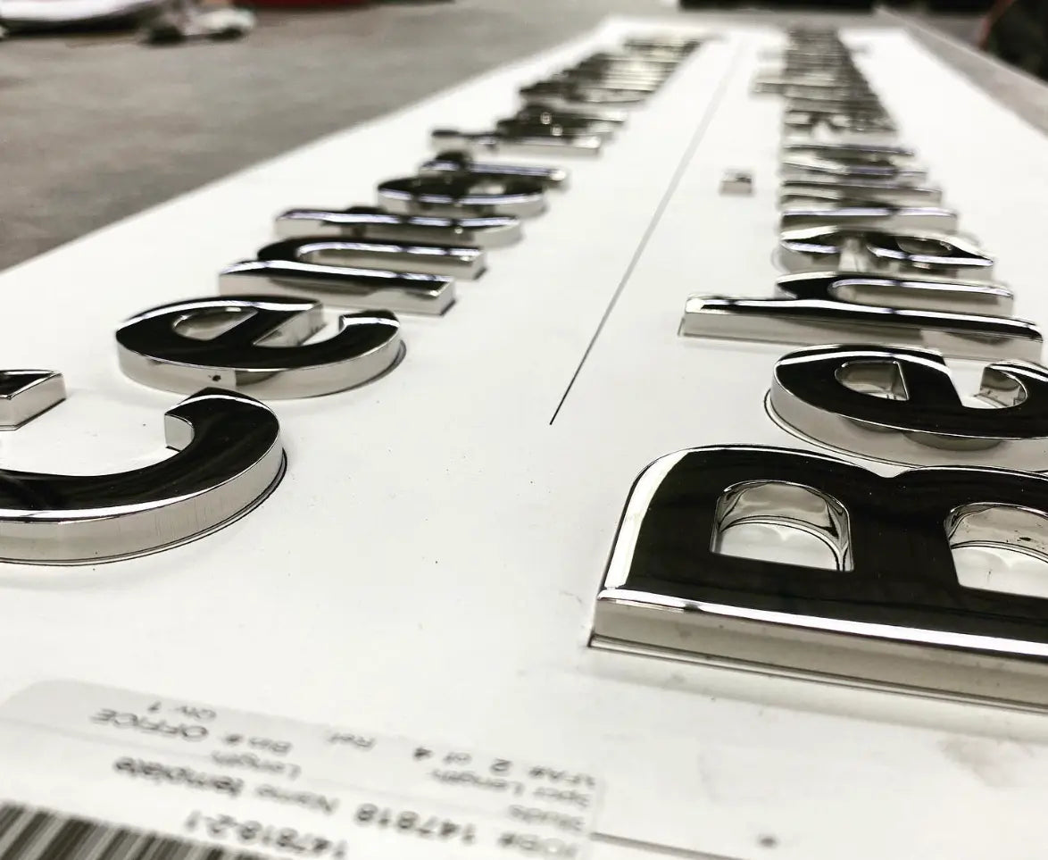 Closeup of polished stainless steel sign letters